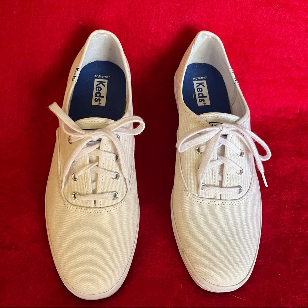 Keds women’s white lace-up sneakers.